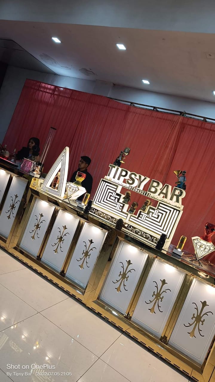 The illuminated Tipsy Bar mobile cocktail counter photographed at an angle